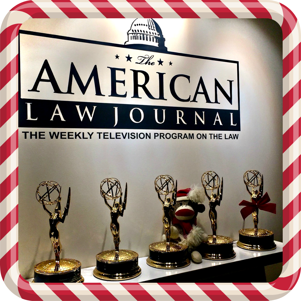 Emmys with Christmas Monkey  with candy cane frame.png